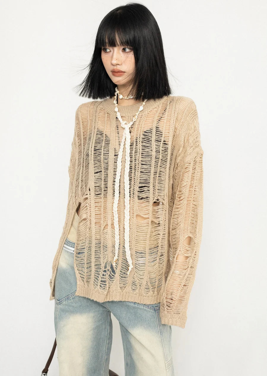 Over-distressed grunge-style see-through knit sweater