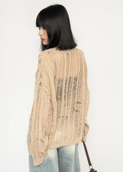 Over-distressed grunge-style see-through knit sweater