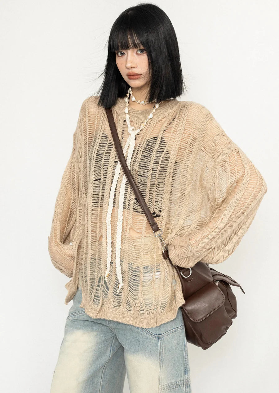 Over-distressed grunge-style see-through knit sweater